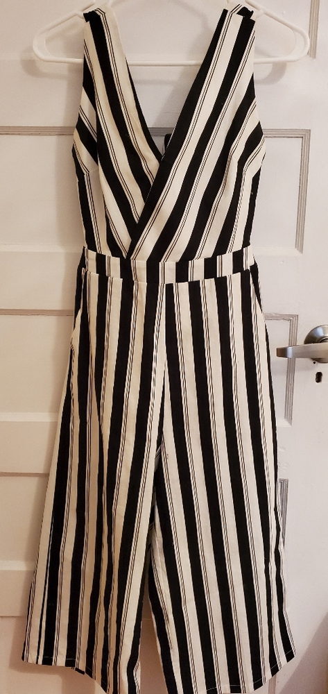 One piece romper, with open tie back. From Honey